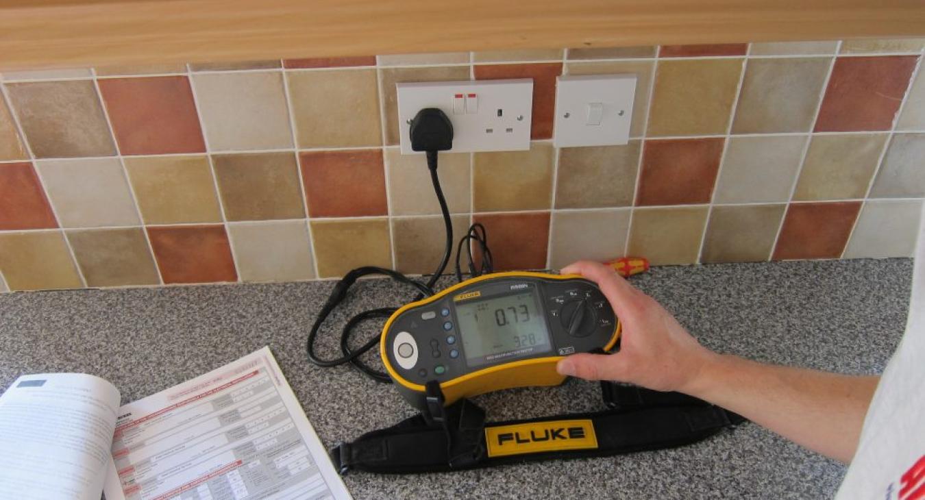 Electrical testing of socket in kitchen