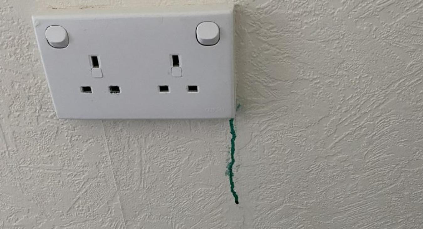 Green goo leaking from electrical socket